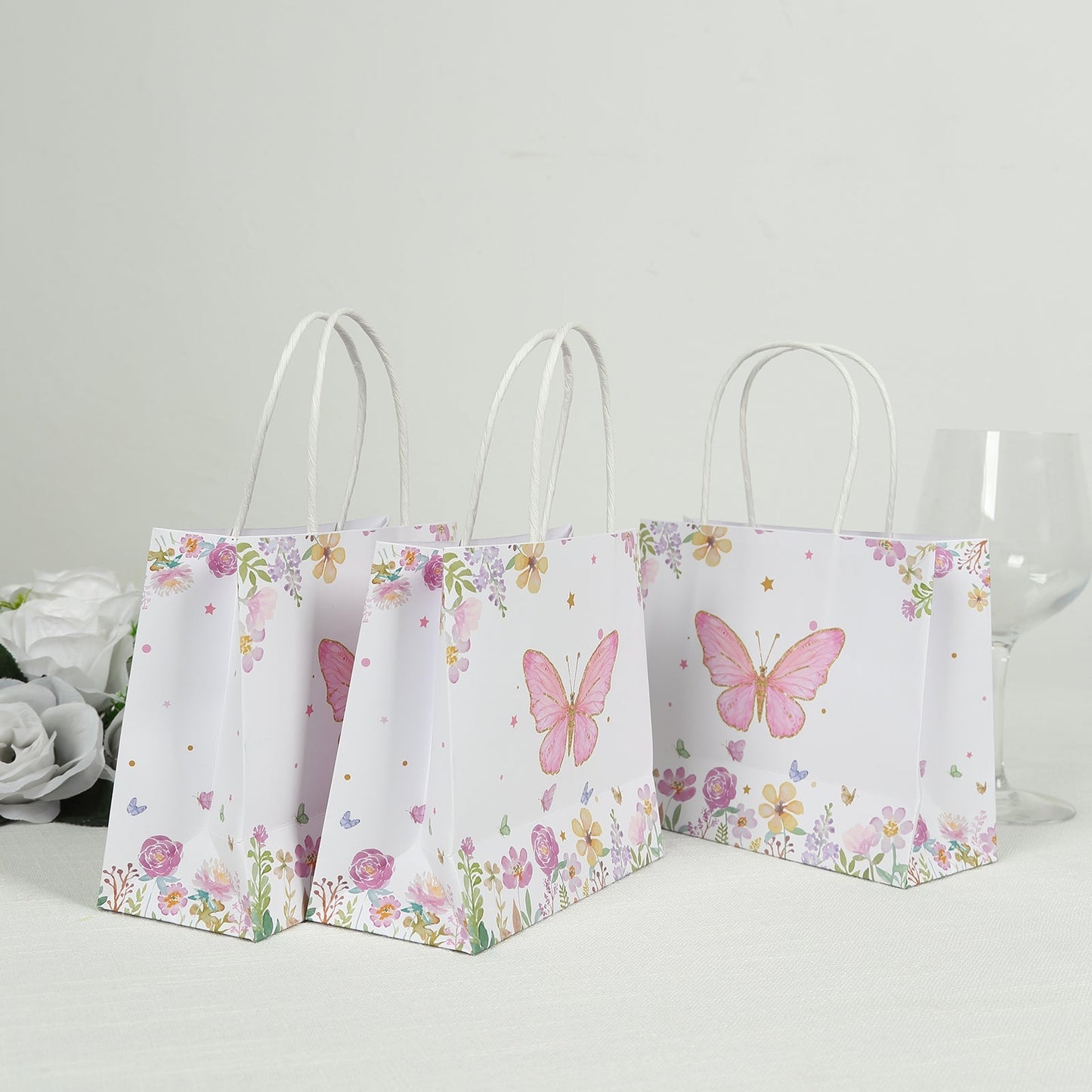 12 Pack Pink Glitter Butterfly Paper Favor Bags with Handles, Floral Print White Goodie Gift Bags - 6"x7"