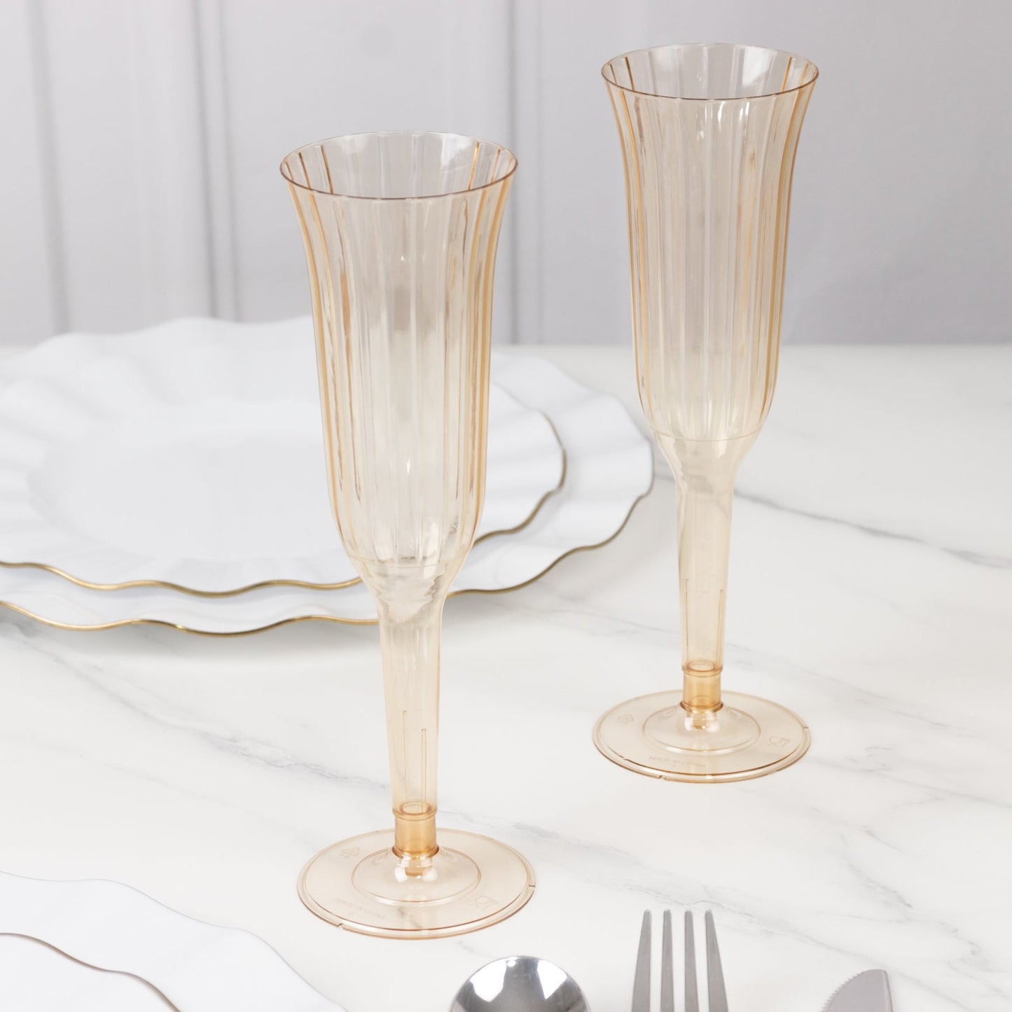 12-Pack Plastic Champagne Flutes Transparent Amber Gold Flared Design - Lightweight Disposable Toasting Glasses 6oz