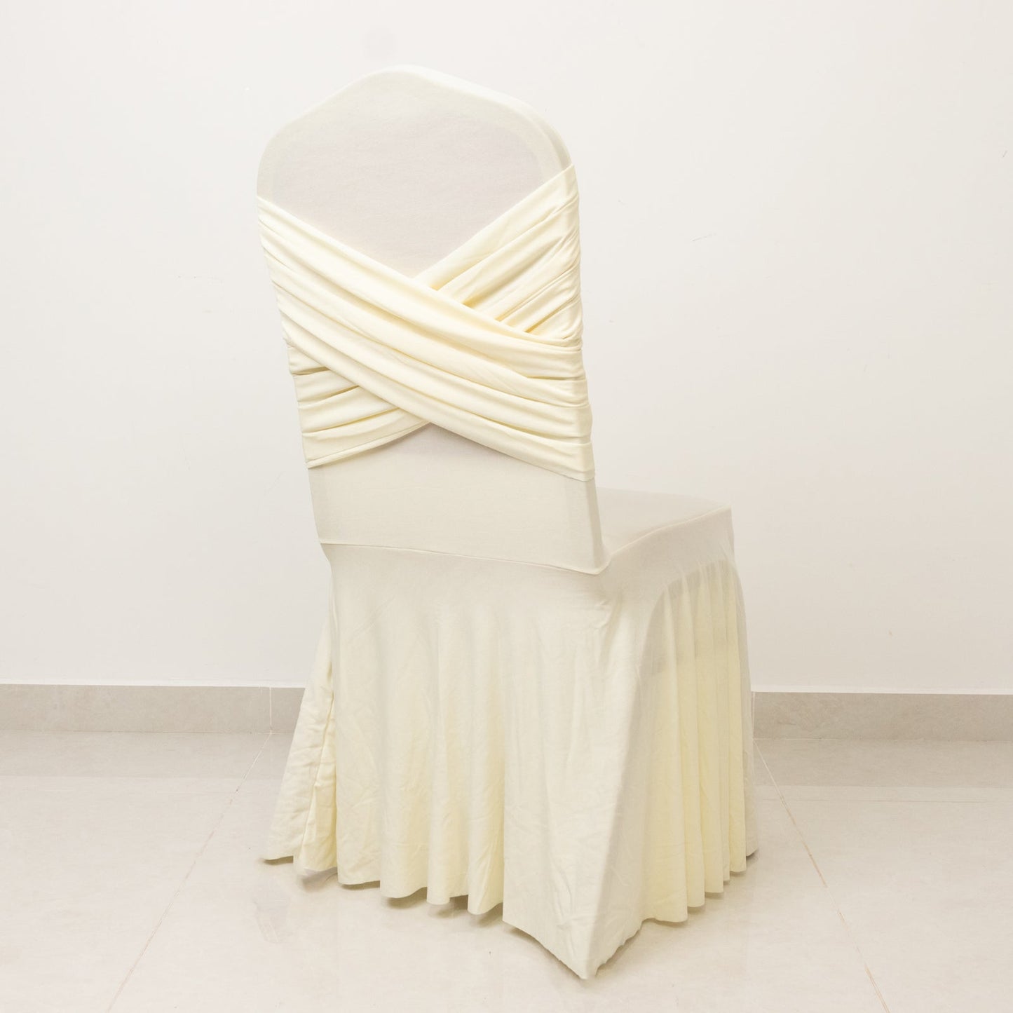 Ivory Spandex Banquet Chair Cover with Ruffle Skirt & Cross Back Sash â€“ Stretch Slipcover for Events