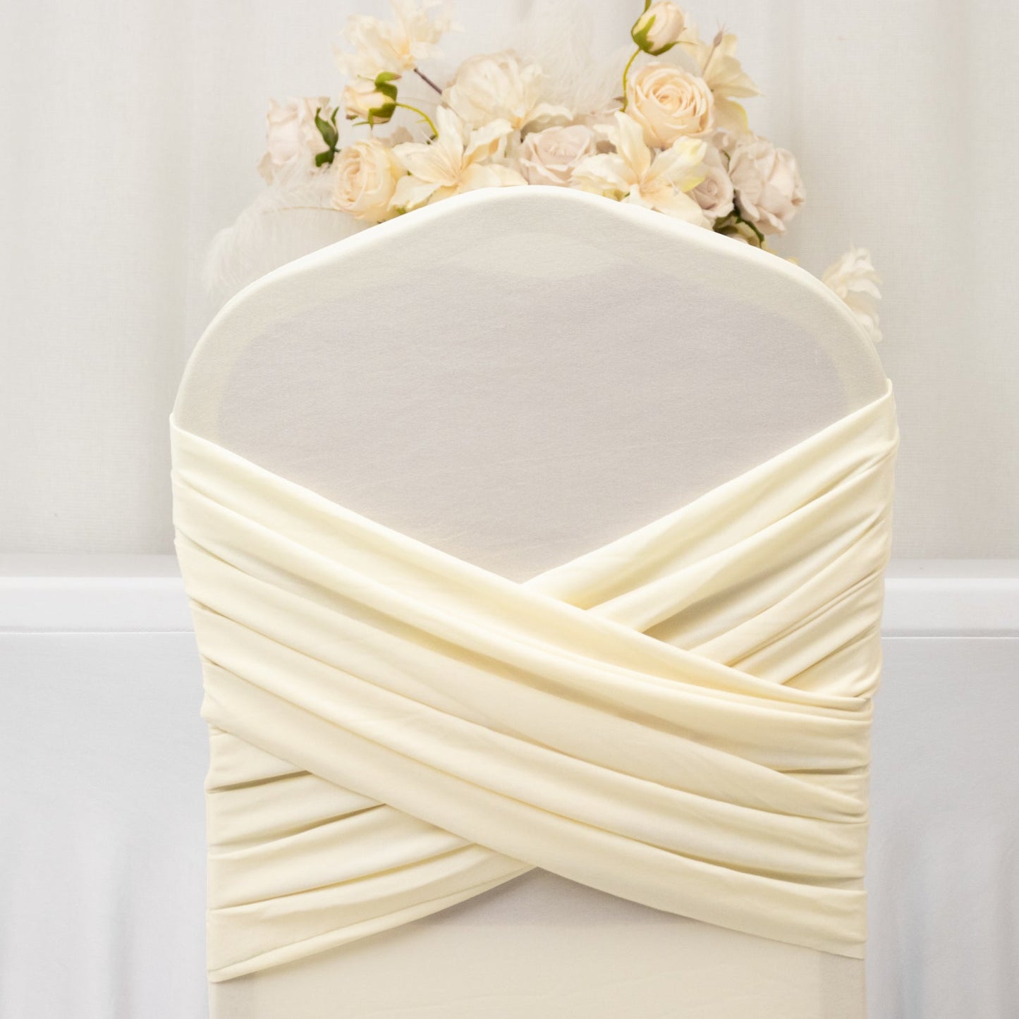Ivory Spandex Banquet Chair Cover with Ruffle Skirt & Cross Back Sash â€“ Stretch Slipcover for Events