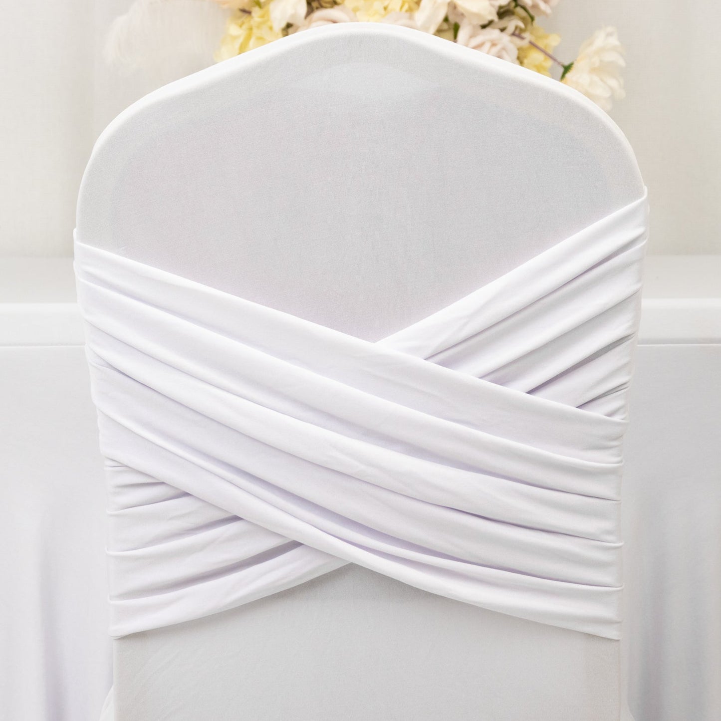 White Spandex Banquet Chair Cover with Ruffle Skirt & Cross Back Sash â€“ Stretch Slipcover for Events