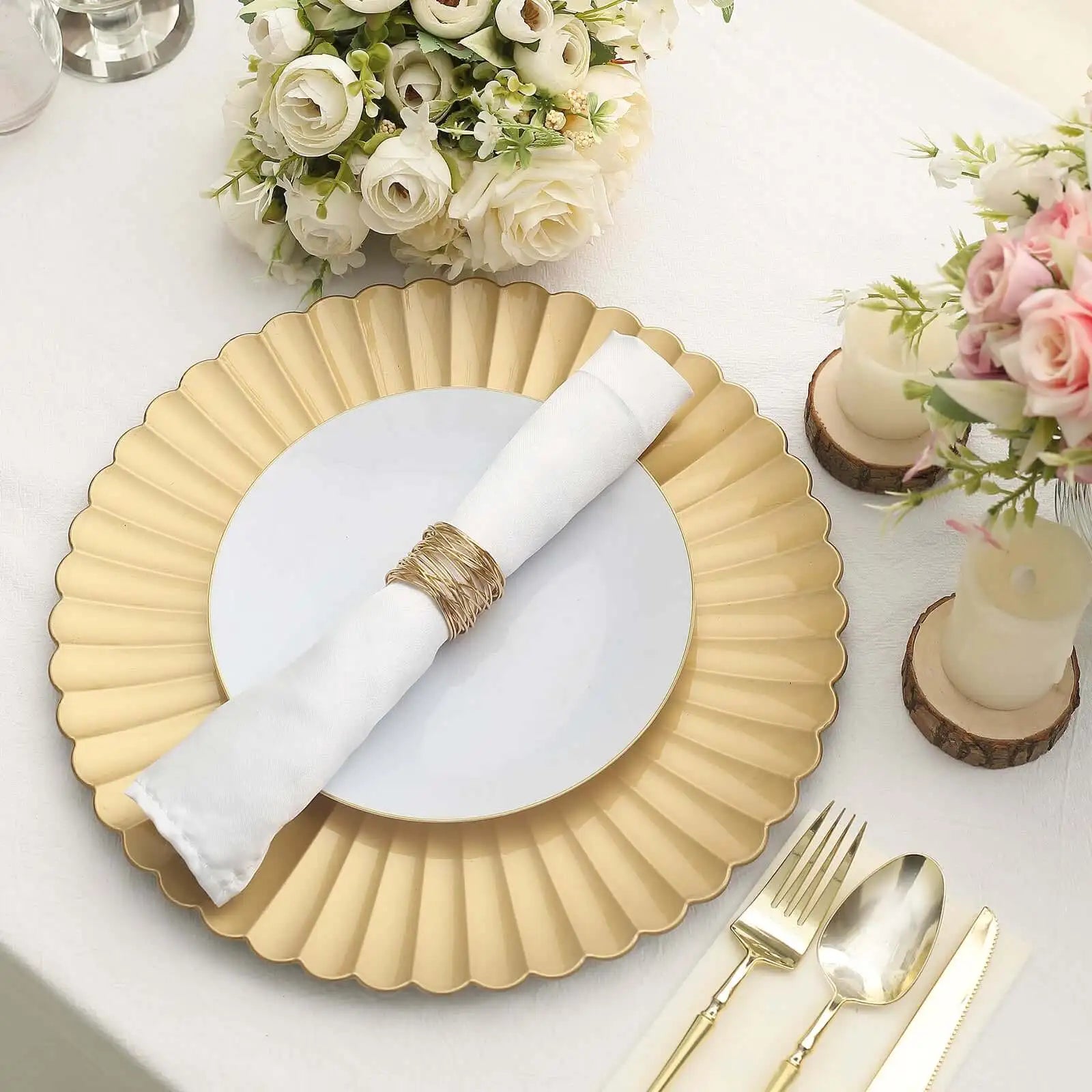 Gold scalloped charger plate with white napkin and silverware set.