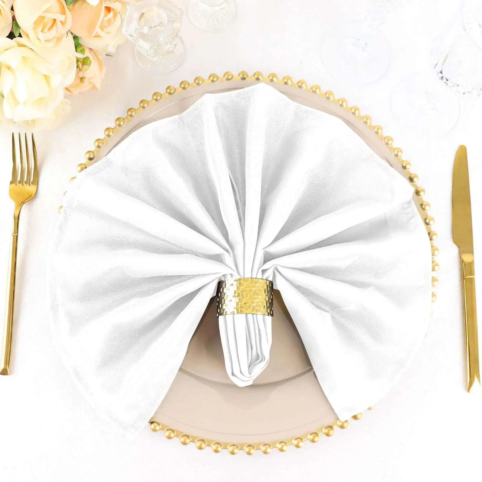 White and gold napkin ring with pearl trim, elegant tableware accessory.